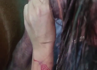 Two women milking brown horse's huge cock